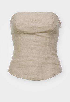 Vaaleanbeige liinapaita ilman olkaimia, jossa on tiukka malli, sileä tekstuuri ja hienovarainen kiilto. Sivuvetoketju sulkeutumiseksi.