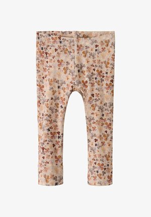 Legins s cvetnim vzorcem v mehkem bež materialu, ki vsebuje majhne oranžne, rjave in sive cvetlične vzorce. Dolžina do gležnjev in raztegljiv material.