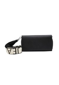 Black leather crossbody bag with a textured surface, featuring a detachable patterned strap in cream and black, with silver hardware accents.
