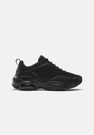 Black athletic sneaker with mesh upper, thick cushioned sole, air cushioning in heel, and lace-up closure facing left on a white background.