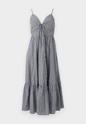 Black and white gingham check sleeveless dress with spaghetti straps, V-neck, front tie detail, and tiered skirt.