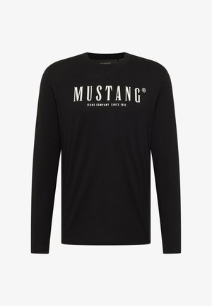 Mustang logo ja tekstiga "JEANS COMPANY SINCE 1932" trükitud must pika varrukaga puuvillane särk, millel on ümar kaelus.