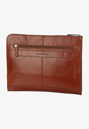 Brown leather zippered pouch with a front pocket, smooth texture, and embossed lettering reading "handcrafted since 1928."