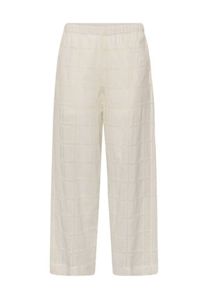 Loose-fit off-white pants with elastic waistband and subtle square eyelet pattern throughout fabric.