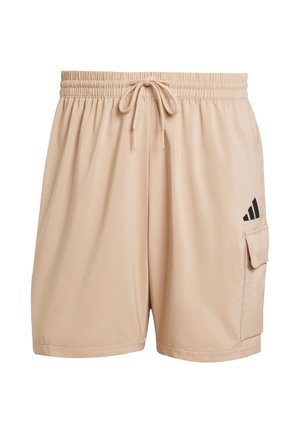Pantaloni sportivi beige con elastico in vita, cordoncino regolabile, tasca laterale e accentuazione del logo del marchio nero sul lato sinistro.