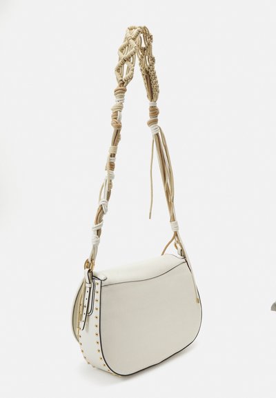White leather shoulder bag with a curved shape, featuring a knotted rope handle and gold studs along the bottom edge.