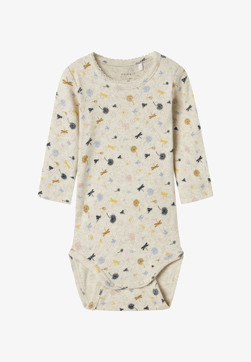 Body z długim rękawem w jasnobeżowym kolorze z kwiatowymi i ważkowymi wzorami w kolorach żółtym, niebieskim, czarnym i różowym. Miękka tkanina z zapięciem na zatrzaski u dołu.