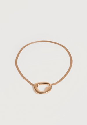 Gold-toned mesh chain necklace with an asymmetrical, polished oval pendant resting on a white surface.