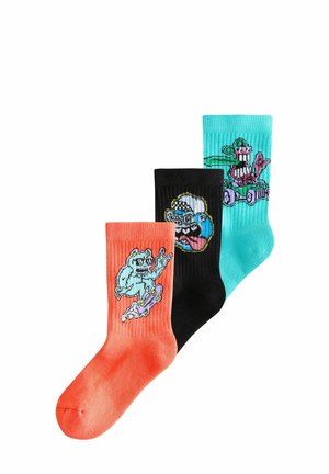 Three pairs of socks: coral with a graphic, black with a graphic, and teal with a graphic. All have ribbed texture and vibrant colors.