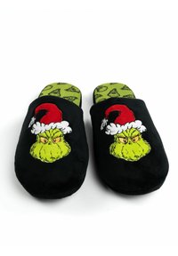 Black fabric slippers with plush texture, featuring a green Grinch face and red Santa hat design; green insole with small Grinch patterns.