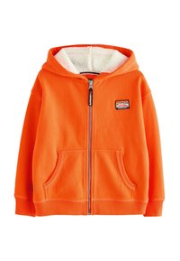 Oranžová mikina na zips s mäkkým, chlpáčovým bielym podšívaním, prednými vreckami a nášivkou na ľavej hrudi. Dlhé rukávy a ribovaný lem.