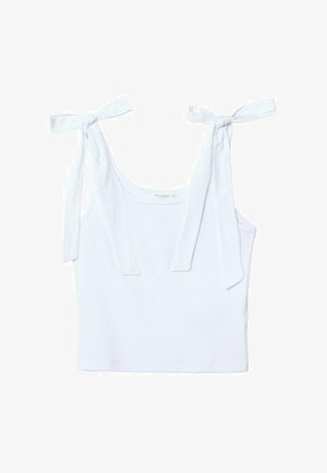 Vit bomullstopp med två knytband, rund halsringning och en figurnära design, med en mjuk och slät textur.