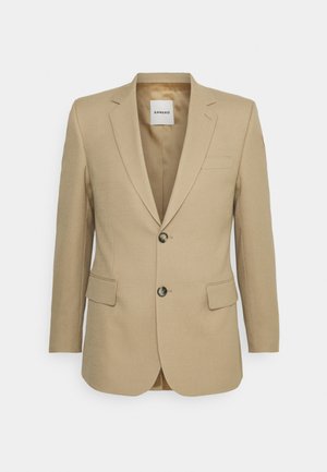 Khaki blazer gemaakt van gestructureerde stof, met een enkelvoudige knoopsluiting, twee voorzakken en subtiele reversdetails.