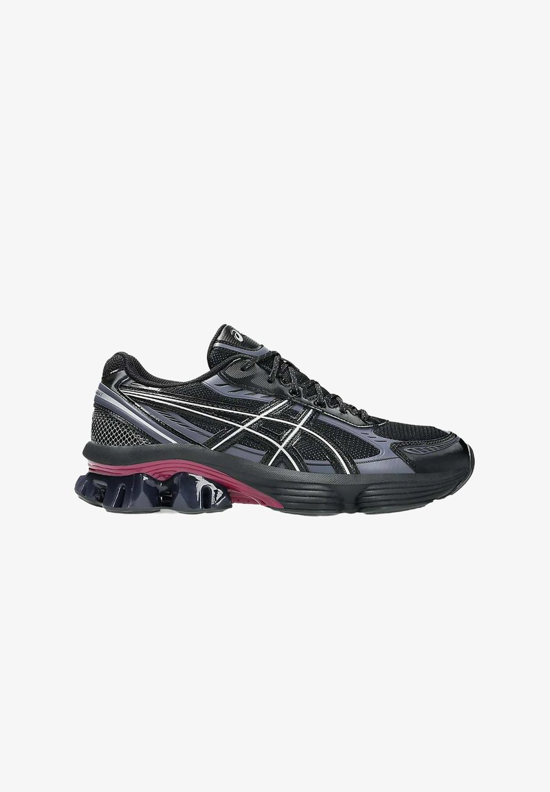 Scarpa da corsa nera con tomaia in mesh, dettagli in viola e argento, suola curva e tallone imbottito con distintivi pod simili a gel.