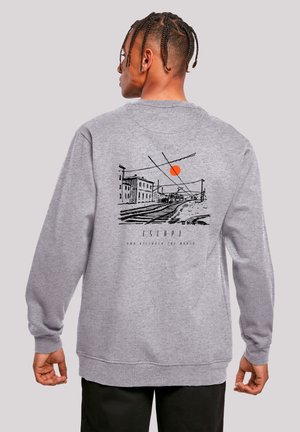 Gray sweatshirt featuring a black and orange graphic of a cityscape with a sun. Long sleeves and ribbed cuffs, relaxed fit.