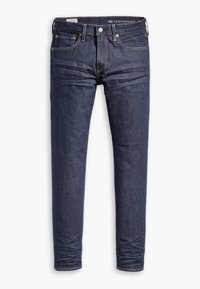Jean slim bleu foncé avec cinq poches et coutures visibles, présenté à plat sur un fond blanc.