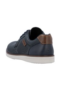Navy blue perforated leather sneaker with brown accents, white rubber sole, and contrasting heel tab. Features rounded toe and lace-up design.