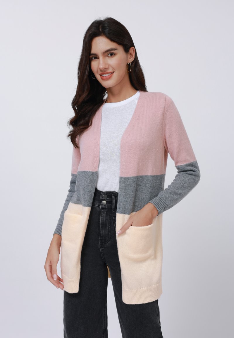 Knitted cardigan in pink, gray, and cream colors. Features two front pockets and a slightly textured fabric with open front design.