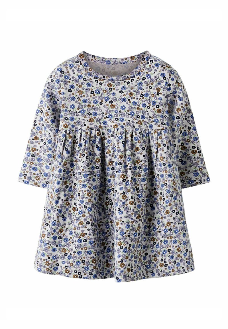 Blomstret kjole med lange ermer, laget av lett stoff. Har hvit bakgrunn med små blå og brune blomster, og innsvingt midje.