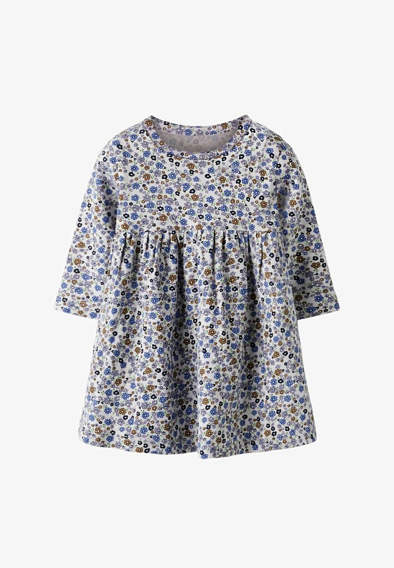 Blomstret kjole med lange ermer, laget av lett stoff. Har hvit bakgrunn med små blå og brune blomster, og innsvingt midje.