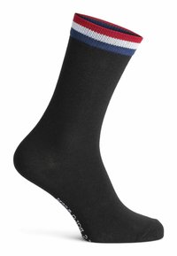 Schwarze Socken mit einem gerippten, mehrfarbigen Bündchen, das rote, weiße und blaue Streifen aufweist. Weicher Stoff, knöchellang, mit einem weißen Logo-Detail am unteren Ende.