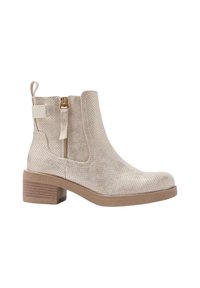 Bottines beige en matériau texturé, dotées d'une fermeture éclair sur le côté, d'une languette au dos et d'un talon bas empilé. Motif perforé sur l'ensemble.
