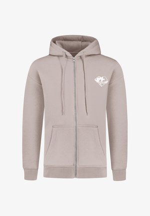 Lichtbruine zip-up hoodie met voorzakken, capuchon met trekkoord en een kleine witte hartvormige graphic met een wereldbol en tekst op de linkerkant van de borst.