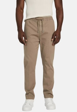 Pantaloni beige su misura con vita a coulisse, passanti sottili e tasche laterali, realizzati in un tessuto liscio e leggero.