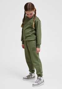 Hummel CLEAN ADJUSTABLE - Trainingsbroek - olivine