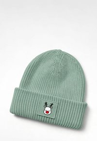 Green ribbed knit beanie with a folded cuff, featuring a rectangular patch with a smiling reindeer face and red nose.