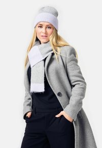 Gray wool coat with button, light gray and lavender striped scarf, and matching beanie. Soft texture, casual design, and relaxed fit.