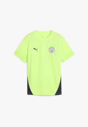 Neon żółta koszulka piłkarska Manchester City z logiem Puma na prawym piersi i herbem klubu na lewym piersi, czarne panele boczne.