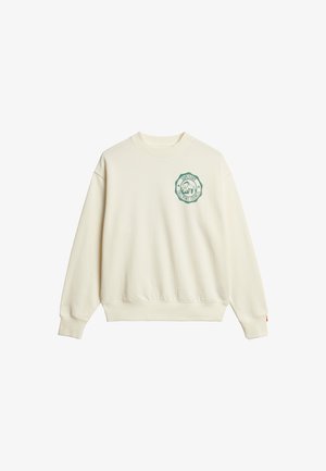 Sudadera color crema con cuello redondo, puños y cinturilla acanalados. Presenta un logo bordado en verde en el lado izquierdo del pecho.