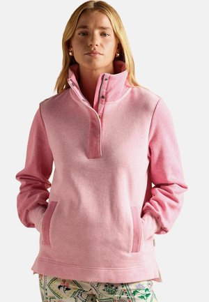 Rosa Fleece-Pullover mit hohem Kragen, halbem Reißverschluss vorne und Tascheneingriff. Weiche Textur, lässige Passform und lange Ärmel.