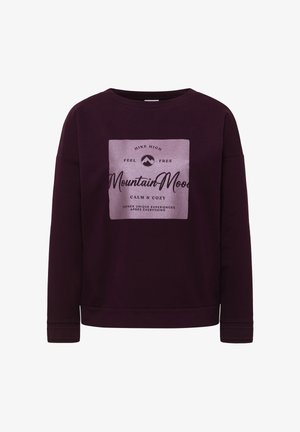Paarse sweater met een zachte textuur. Bevat een centraal vierkant grafisch ontwerp in het roze met zwarte tekst en een bergenlogo. Geribbelde manchetten en zoom.