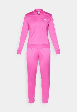 Pink tracksuit made of smooth, lightweight material; features a zip-up jacket with a stand collar and contrasting white stripes on sleeves and pants.