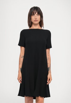 Black short-sleeve dress made from lightweight fabric, featuring a round neckline and flared skirt, with a simple, clean design and no patterns.