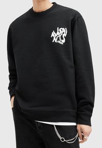 Black sweatshirt made of cotton blend, featuring a white graphic logo on the left chest. Ribbed crew neck and cuffs with a relaxed fit.