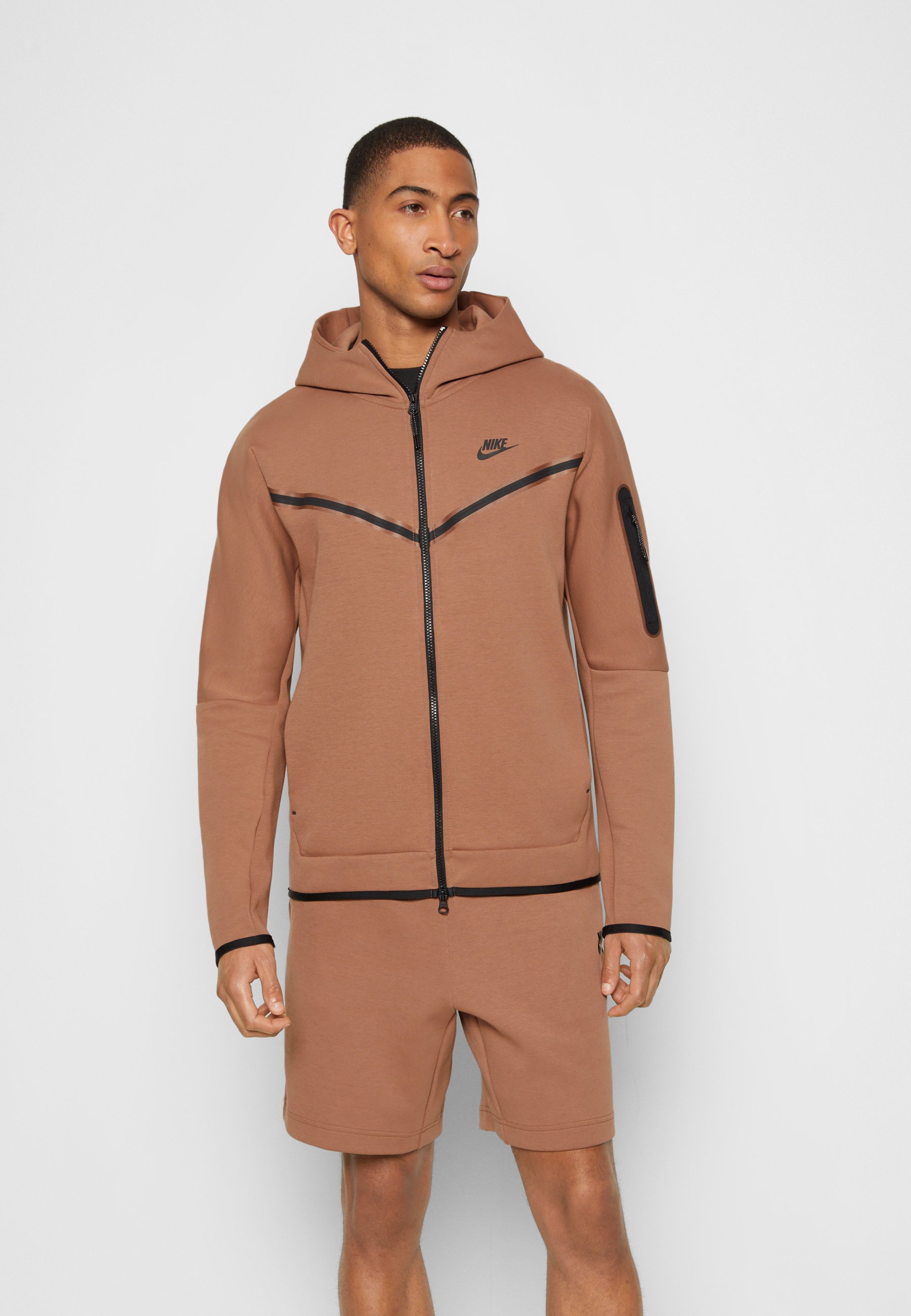 brown nike tech suit
