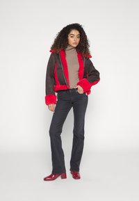 Levi's® SUPERLOW BOOTCUT - Bootcut jeans - first or last