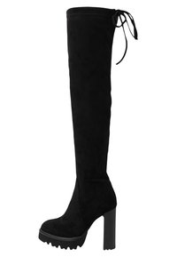 Botte haute à plateforme en daim noir, avec talon haut épais, bout rond, semelle crantée et fermeture par lacets à l'arrière supérieur.