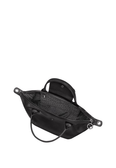 Black leather handbag with dual handles, zipper closure, and patterned fabric lining. Features a small pocket with button closure inside.