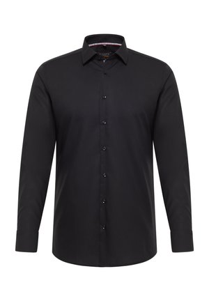 Zwart shirt met lange mouwen gemaakt van gladde stof. Voorzien van een knoopsluiting aan de voorkant, een klassieke kraag en manchetten met één knoop. Subtiele stiksel details.