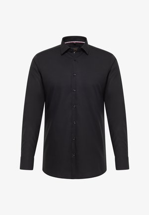 Zwart shirt met lange mouwen gemaakt van gladde stof. Voorzien van een knoopsluiting aan de voorkant, een klassieke kraag en manchetten met één knoop. Subtiele stiksel details.