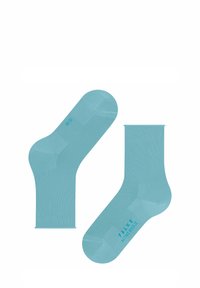 Helle blaue Baumwollsocken mit nahtlosem Design, geripptem Bündchen und bedrucktem Branding auf der Sohle. Knöchellang mit einer glatten Textur.