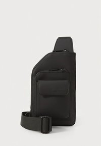 Black crossbody bag made of smooth synthetic material, featuring a zippered main compartment, an additional front pocket, and a detachable strap.