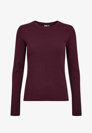Burgunderrotes Langarmshirt aus geripptem Stoff. Es hat einen klassischen Rundhalsausschnitt und eine figurbetonte Silhouette, ohne sichtbare Muster oder Akzente.