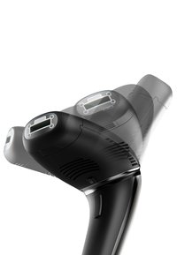Handheld device in black plastic with a curved handle, featuring a movable top section and a digital display. Vent details visible on sides.