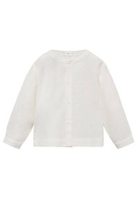 Camicia bianca in lino con scollatura rotonda, maniche lunghe e chiusura con bottoni. Il tessuto ha un aspetto leggero e strutturato.