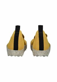 Yellow mesh sneakers with a black rear accent, textured upper, and a white speckled outsole featuring a zigzag pattern.